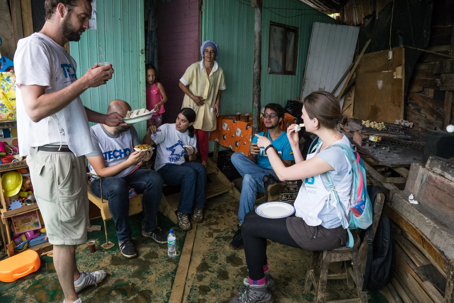 Techo volunteers enjoying Marinas delicious homemade food